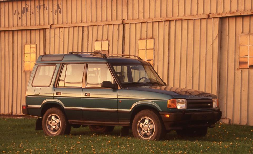<p>The Land Rover Discovery debuted alongside the Defender 90 as the second and third Land Rover models to hit the U.S. shores in the 1990s. Meant to be a more-affordable luxury SUV to compete with vehicles like the Jeep Grand Cherokee, the first Discovery used Land Rover's aluminum 3.9-liter V-8 backed by either a five-speed manual (rare) or a four-speed automatic. Discoverys sent stateside were plush vehicles; most had leather interiors, power seats and climate control. Discos were all five-passenger vehicles unless there was a "7" designation in the trim level, denoting two additional folding seats in the cargo hold. An optional fold-down step on the rear bumper helped those way-back passengers crawl into their seats via the trunk. Like all Rovers of the time, the Disco used strong solid axles suspended by long-travel coil springs. This suspension worked incredibly well off-road, clawing up trails that would challenge a Jeep Wrangler.</p>