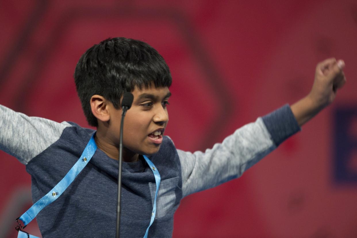 Nihar Saireddy Janga, 11, of Austin, Texas, reacts to correctly spelling a word during the final round of the Scripps National Spelling Bee in National Harbor, Md., Thursday, May 26, 2016. (AP Photo/Cliff Owen)