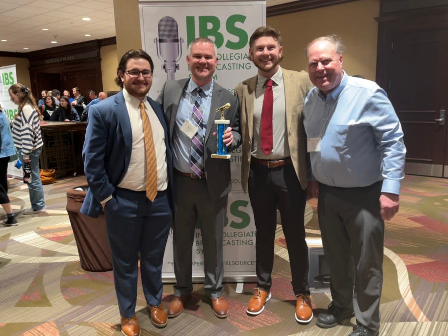 The St. Ambrose group that accepted the national award in New York were (L-R) Ryan Schiestel (junior), Greg Armstrong (clinical instructor), Dave Girgenti (senior), and Dave Baker (operations manager, KALA-FM).