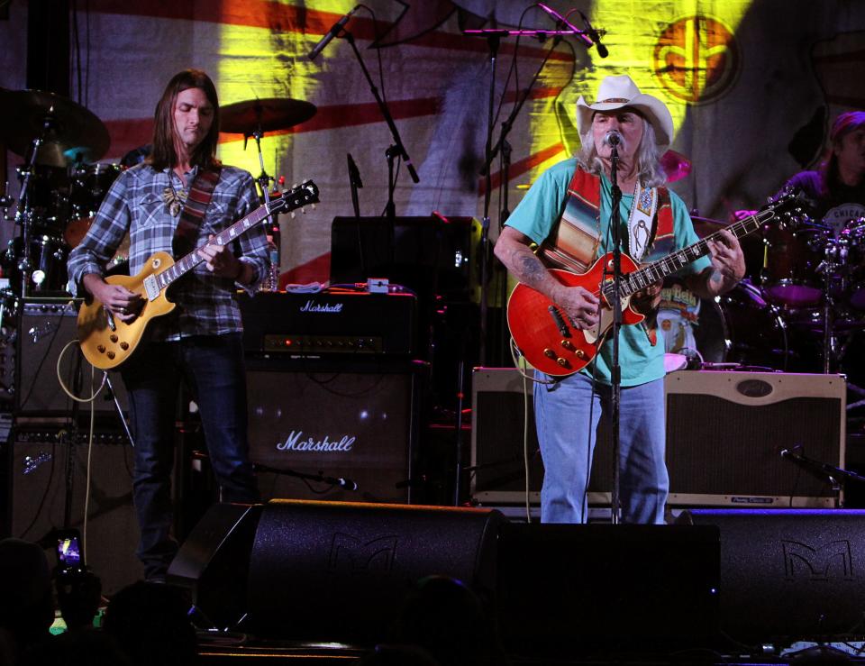 Duane Betts, left, is pictured here performing alongside his father Dickey Betts at Sarasota's Robarts Arena in 2014.