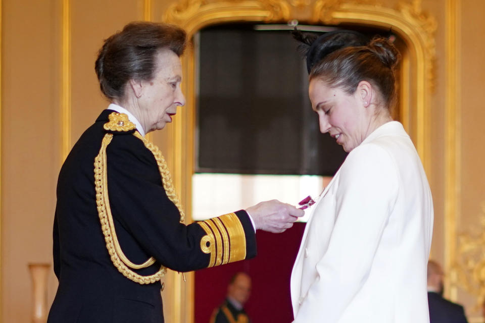 Britain’s Princess Anne, left, makes referee Sara Cox, from Exeter, a Member of the Order of the British Empire, at Windsor Castle, in Windsor, England, Tuesday, Feb. 6, 2024. The honour recognises services to the rugby union football. (Yui Mok/PA via AP)