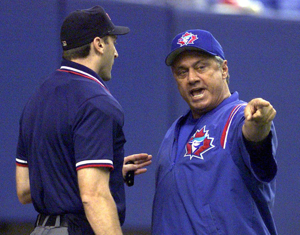 FILE - In this Saturday, July 8, 2000, file photo, Toronto Blue Jays manager Jim Fregosi, right, argues with home plate umpire Jim Lamplugh during a baseball game against the Montreal Expos in Montreal. Fregosi, a former All-Star who won more than 1,000 games as a manager for four teams, has died after an apparent stroke. He was 71. The Atlanta Braves say they were notified by a family member that died early Friday, Feb. 14, 2014, in Miami, where he was hospitalized after the apparent stroke while on a cruise with baseball alumni. (AP Photo/Ryan Remiorz, File)