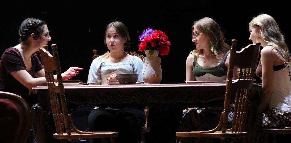 The March sisters - from left, Joe (Layla Rorem), Amy (Anna Grygier ), Meg (Patti Maisano) and Beth (Hannah Galambs) - talk it over at the dining room table in this rehearsal scene from ACU's "Little Women."