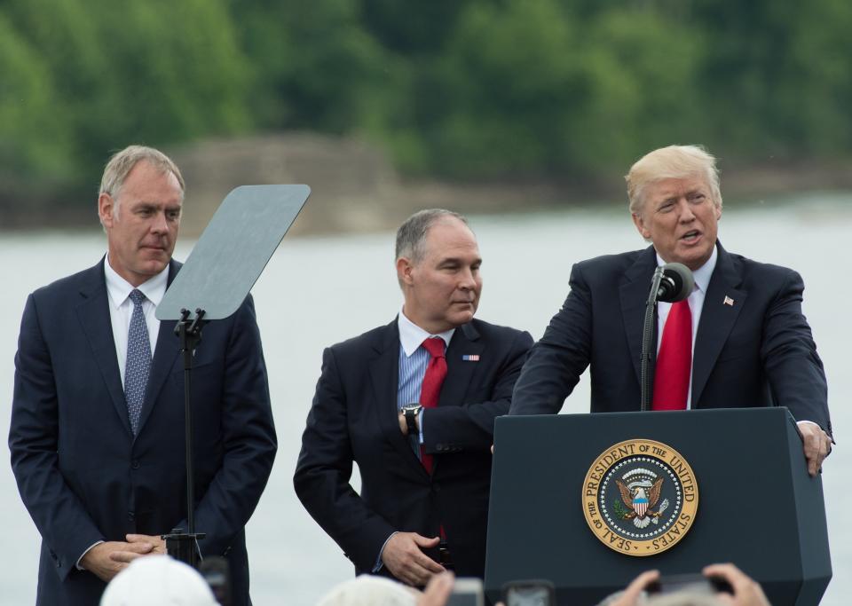 Trump and his initial appointees to run the Interior Department and the EPA &mdash; Ryan Zinke (left) and Scott Pruitt (center) &mdash; declared war on environmental protection. (Photo: NICHOLAS KAMM via Getty Images)