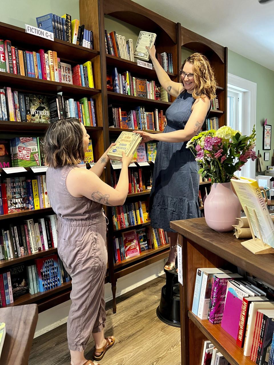 Owners Jessica Callahan, left, and Julie Ross appear at their bookstore Pocket Books Shop in Lancaster, Pa., on Sunday, May 21, 2023. The independent bookselling community continues to grow, with membership in the American Booksellers Association reaching its highest levels in more than 20 years. (Austin Carter/Pocket Books via AP)