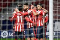 Atletico Madrid players celebrate one of their goals in a 3-1 win over Valencia in La Liga on Sunday