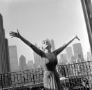 <p>Actress, singer, and dancer Julie Newmar had quite the view from the terrace of her Beekman Place apartment. This photograph was taken in 1960; later that decade, she would go on to star in <em>Batman</em> as Catwoman.</p>