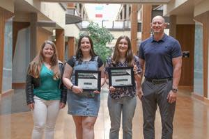 The Gentex Foundation has named Madelyn Rynsburger and Paige Lampen the first recipients of the Amanda Clark Scholarship, a new program announced in October of last year, to support female high school seniors pursuing a degree in science, technology, engineering, or math (STEM). Left to right: Ally Clark (Amanda Clark’s Daughter), Paige Lampen (Scholarship Winner), Madelyn Rynsburger (Scholarship Winner), Seth Bushouse (Gentex Sr. Dir. Human Resources)