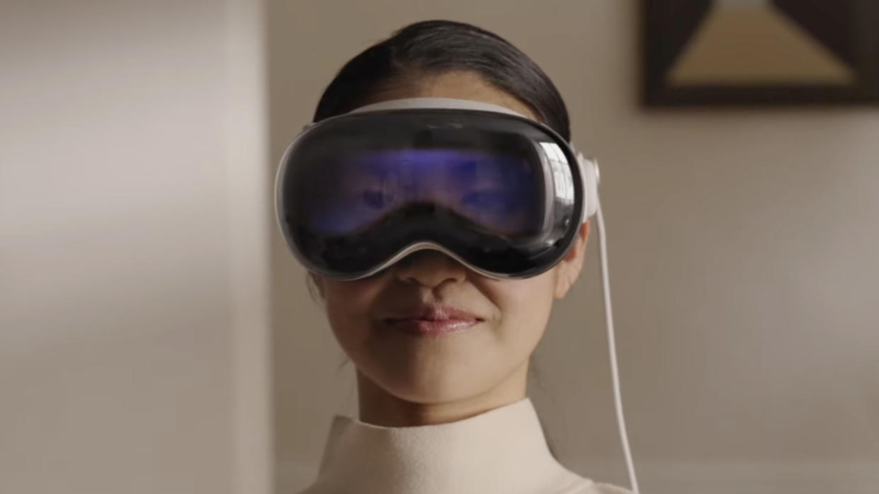  A woman wearing the Apple Vision Pro headset. 