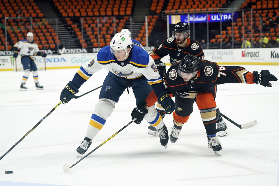 St. Louis Blues left wing Sammy Blais (9) is defended by Anaheim Ducks' Josh Mahura during the first period of an NHL hockey game Wednesday, March 3, 2021, in Anaheim, Calif. (AP Photo/Marcio Jose Sanchez)