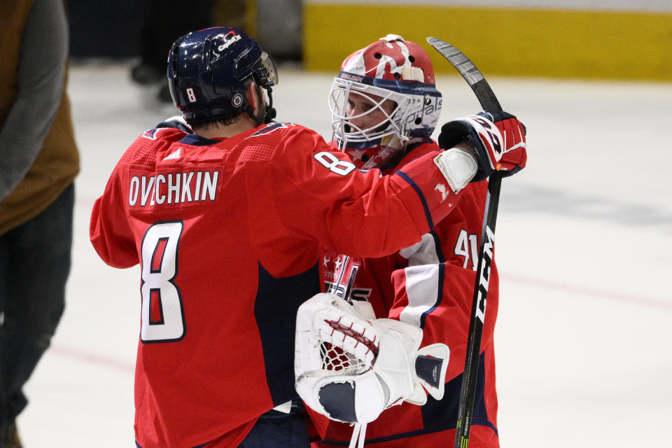 Washington Capitals left wing Alex Ovechkin (8) and goaltender Vitek Vanecek (41) celebrate after an NHL hockey game against the Seattle Kraken, Saturday, March 5, 2022, in Washington. (AP Photo/Nick Wass)