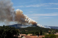 <p>Smoke fills the sky above a burning hillside in Bormes-les-Mimosas, in the Var department, France, July 26, 2017. (Jean-Paul Pelissier/Reuters) </p>