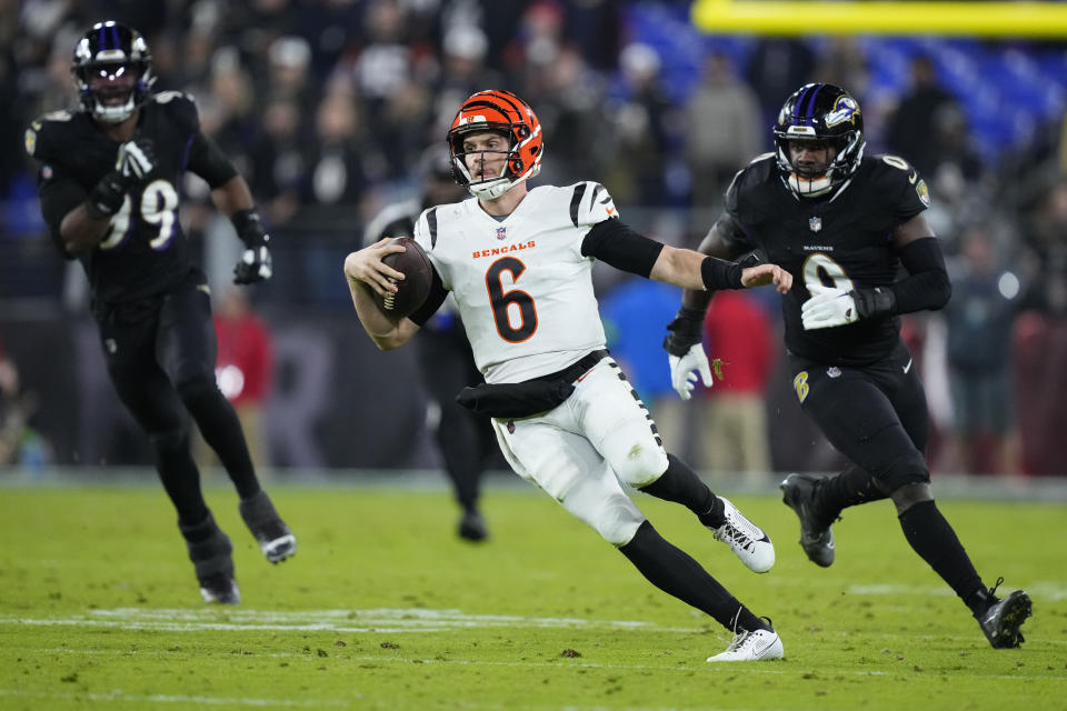Cincinnati Bengals quarterback Jake Browning (6) runs the ball in the second half of an NFL football game against the Baltimore Ravens in Baltimore, Thursday, Nov. 16, 2023. (AP Photo/Matt Rourke)