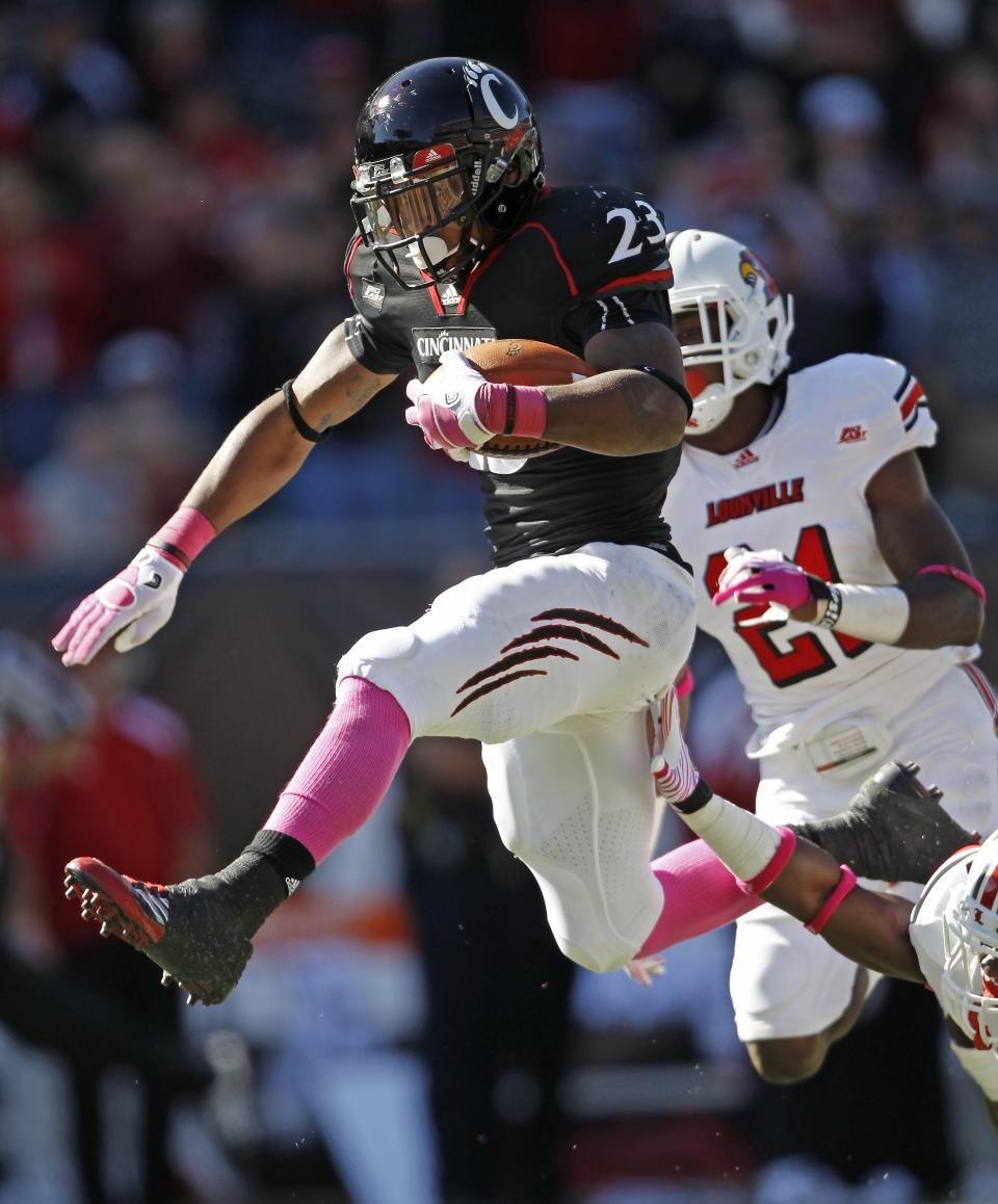 OCTOBER 15, 2011: University of Cincinnati's Isaiah Pead breaks away for a 50 yard run touchdown run in the fourth quarter against Louisville during their game at Paul Brown Stadium.