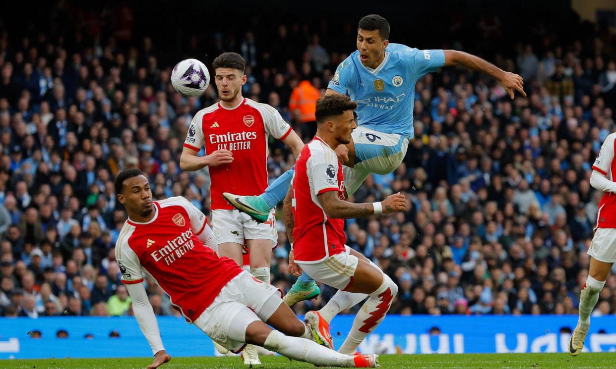 <span>Rodri shoots under pressure from Arsenal defenders.</span><span>Photograph: Tom Jenkins/The Guardian</span>