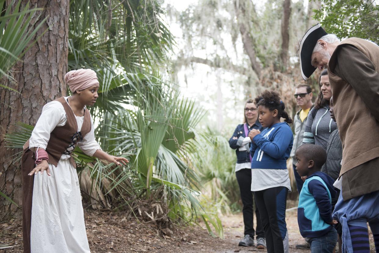 Melissa Schuster portrays a woman fleeing slavery in British South Carolina searching for freedom at Fort Mose in Spanish Florida during the 18th century at Fort Mose Historic State Park in 2018. The park, north of St. Augustine, is among many area sites where people can learn about the area's long African American history during Black History Month.