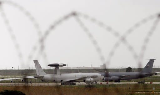 Nato Awacs planes and a US miltary plane stand on the tarmac of the Trapani Birgi airbase in the southern Italien island of Sicily on Friday. Italy's government held emergency talks on Libya today after the UN Security Council cleared the way for air strikes by approving "all necessary measures" to impose a no-fly zone on Libya