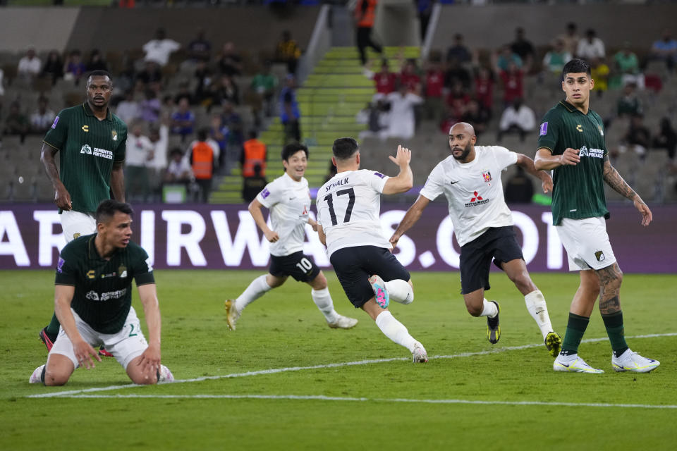 Urawa Reds' Alex Schalk, center, celebrates scoring his side's opening goal during the Soccer Club World Cup second round soccer match between Club Leon and Urawa Reds at Prince Abdullah Al-Faisal Stadium in Jeddah, Saudi Arabia, Friday, Dec. 15, 2023. (AP Photo/Manu Fernandez)