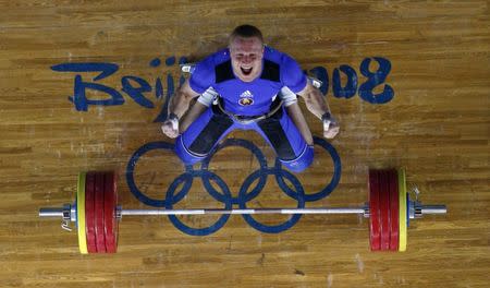 Andrei Rybakou of Belarus reacts after lifting 209kg in the men's 85kg Group A clean and jerk weightlifting competition at the Beijing 2008 Olympic Games August 15, 2008. REUTERS/Yves Herman