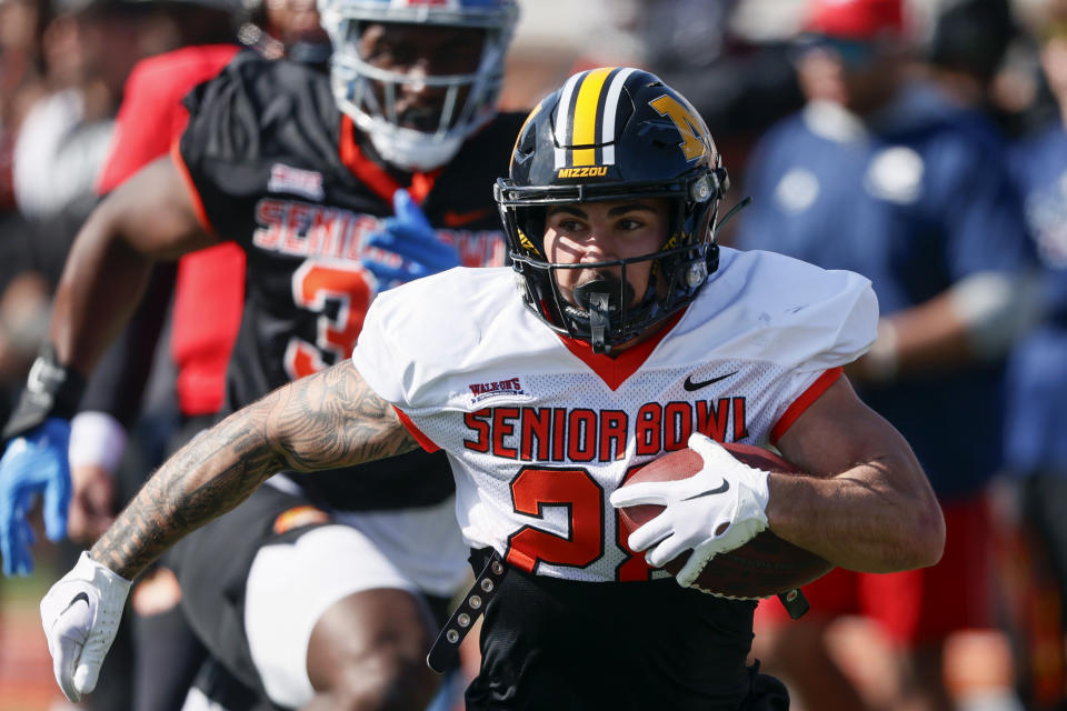 American running back Cody Schrader (28), of Missouri, carries the ball during practice for the Senior Bowl NCAA college football game, Tuesday, Jan. 30, 2024, in Mobile, Ala. (AP Photo/ Butch Dill)
