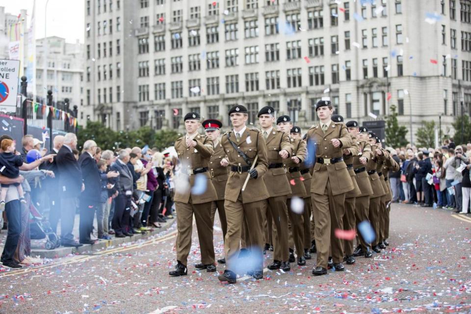 Parade: members of the British armed forces during the National Armed Forces Day (EPA)