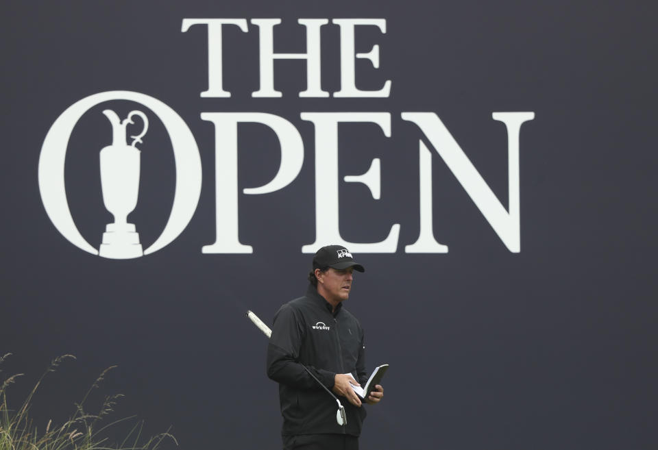 Phil Mickelson of the United States looks at his putt on the 18th green during the first round of the British Open Golf Championships at Royal Portrush in Northern Ireland, Thursday, July 18, 2019.(AP Photo/Jon Super)