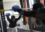 A member of the Afghan national boxing team attends a training session in local gym in Serbia, Wednesday, Dec. 1, 2021. They practiced in secrecy and sneaked out of Afghanistan to be able to compete at an international championship. Now, the Afghan boxing team are seeking refuge in the West to be able to continue both their careers and lives without danger or fear. (AP Photo/Darko Vojinovic)