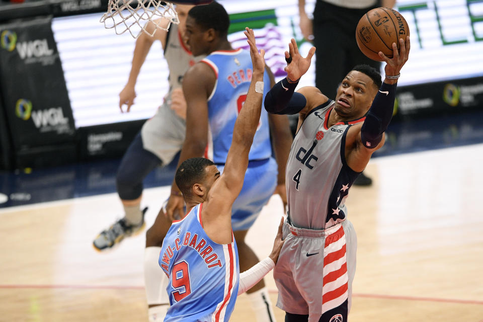 Washington Wizards guard Russell Westbrook (4) goes to the basket against Brooklyn Nets guard Timothe Luwawu-Cabarrot (9) during the first half of an NBA basketball game, Sunday, Jan. 31, 2021, in Washington. (AP Photo/Nick Wass)