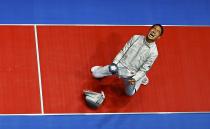 <p>Kim Jung-Hwan (KOR) of South Korea celebrates winning the match. REUTERS/Issei Kato </p>