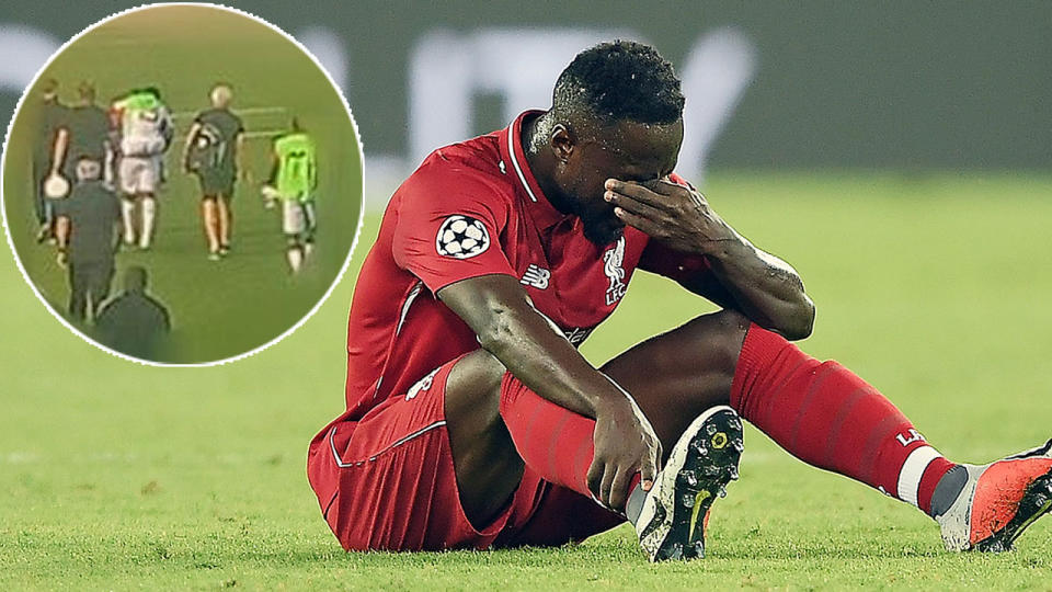 Liverpool’s Naby Keita was forced to be piggy-backed from the pitch with no stretcher available. Pic: Twitter/Getty