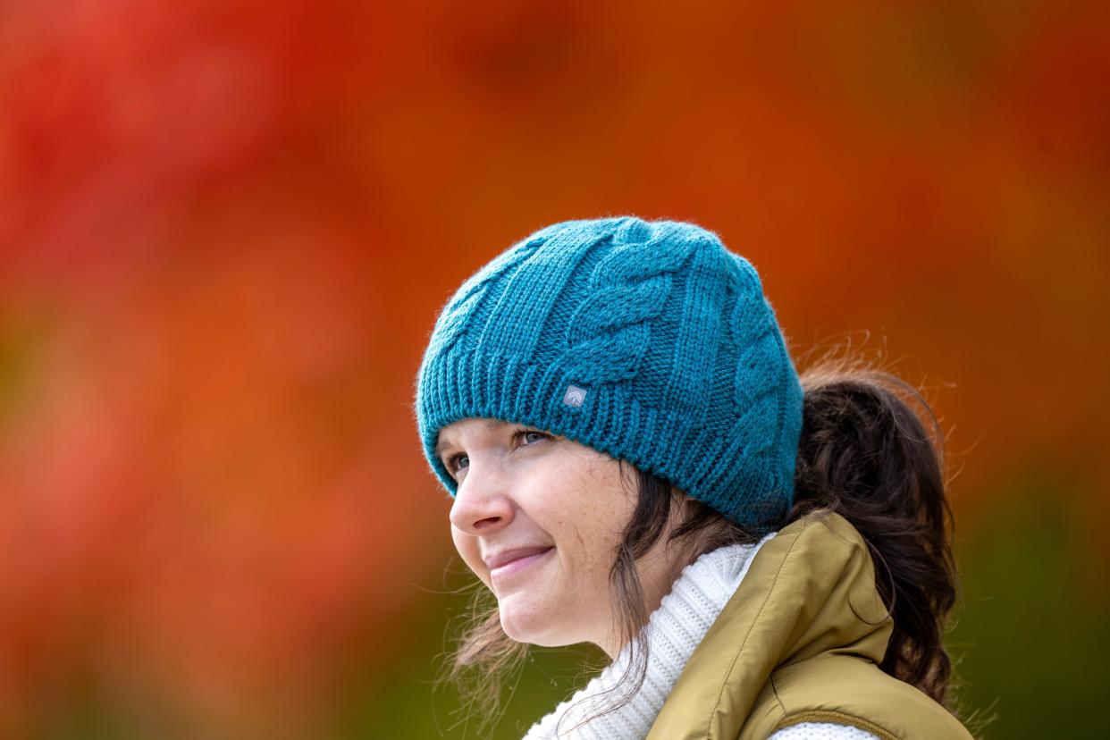 Danica Lause wears one of the hats she designed. Through automation and innovation, Lause has successfully moved all of her Peekaboos Ponytail Hats production from China to Germantown. Her hats are designed with holes for ponytails.