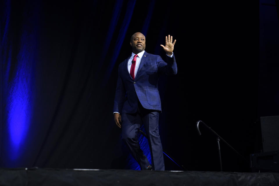 Republican presidential candidate Sen. Tim Scott, R-S.C., walks on stage before speaking at the Family Leadership Summit, Friday, July 14, 2023, in Des Moines, Iowa. (AP Photo/Charlie Neibergall)