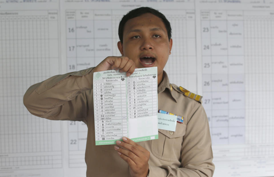 A Thai officer counts ballots after closing a polling station in Bangkok, Thailand, Sunday, March 24, 2019. Nearly five years after a coup, Thailand voted Sunday in a long-delayed election setting a military-backed party against the populist political force the generals overthrew. (AP Photo/Sakchai Lalit)