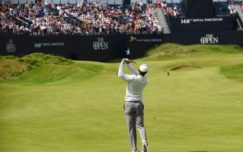 US golfer Tiger Woods plays onto the 18th green during a practice session at The 148th Open golf Championship at Royal Portrush golf club in Northern Ireland - Credit: AFP