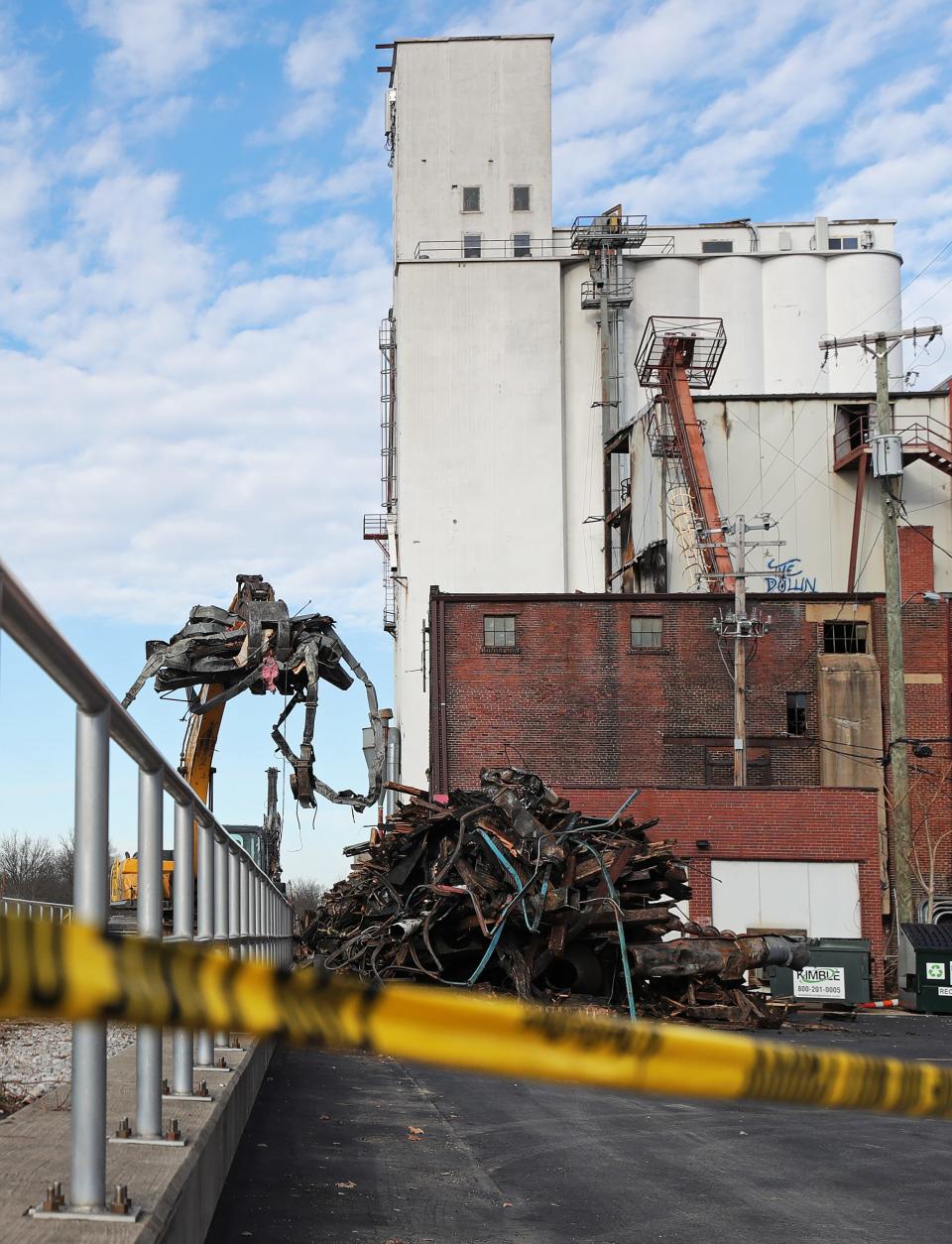 Heavy machinery is used on Monday to remove rubble from the scene where a large structure fire last week destroyed a part of the Star of the West Milling Co. in Kent.