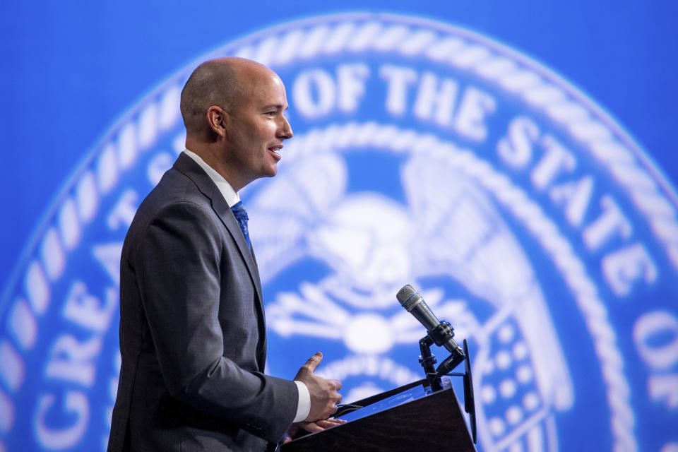 FILE - In this March 18, 2021, file photo, Utah Gov. Spencer Cox speaks during his monthly news conference in Salt Lake City. The governor of Utah has defended his position to support a minority scholarship program sponsored by the Utah Jazz despite criticism from some who have called the program racist. (Spenser Heaps/The Deseret News via AP, Pool, File)