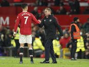 Manchester United's manager Ralf Rangnick shakes hands with Manchester United's Cristiano Ronaldo at the end of the English Premier League soccer match between Manchester United and Crystal Palace at Old Trafford stadium in Manchester, England, Sunday, Dec. 5, 2021. (AP Photo/Jon Super)