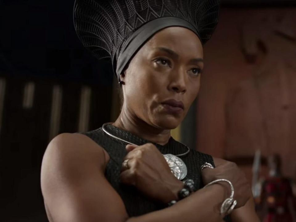 Angela Bassett as Queen Ramonda doing the Wakanda Forever salute.