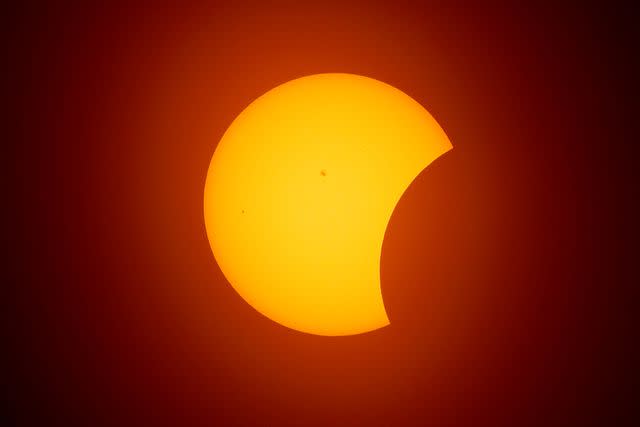 <p>Ron Jenkins/Getty </p> The solar eclipse is seen on April 8, 2024 in Fort Worth, Texas.