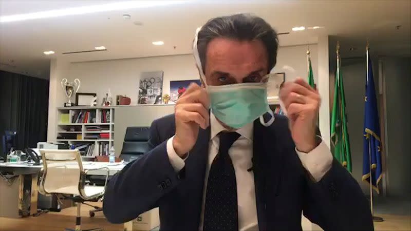 FILE PHOTO: Head of Italy's Lombardy region in isolation after aide gets coronavirus