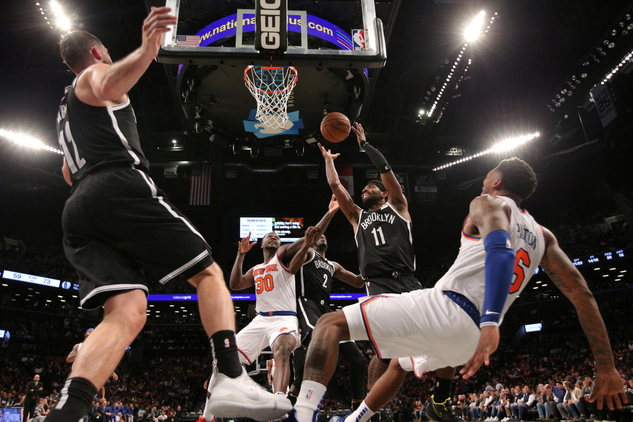 Oct 25, 2019; Brooklyn, NY, USA; Brooklyn Nets point guard Kyrie Irving (11) grabs a rebound against the New York Knicks during the third quarter at Barclays Center. Mandatory Credit: Brad Penner-USA TODAY Sports     TPX IMAGES OF THE DAY