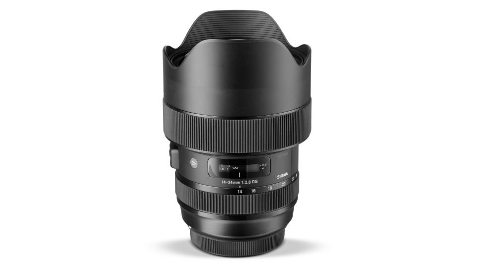 Sigma 14-24mm f/2.8 DG HSM | A lens stood vertically on white background