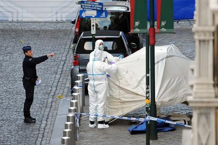 Police personnel are seen at the site of a shooting in central Brussels May 24, 2014. REUTERS/Eric Vidal/File Photo