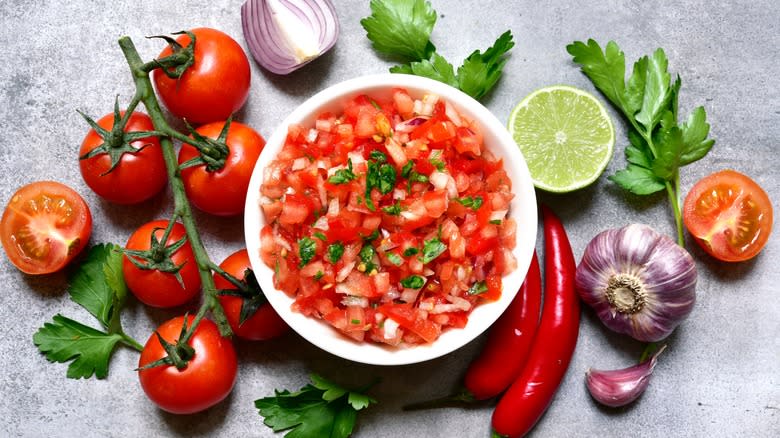 Mexican salsa surrounded by ingredients