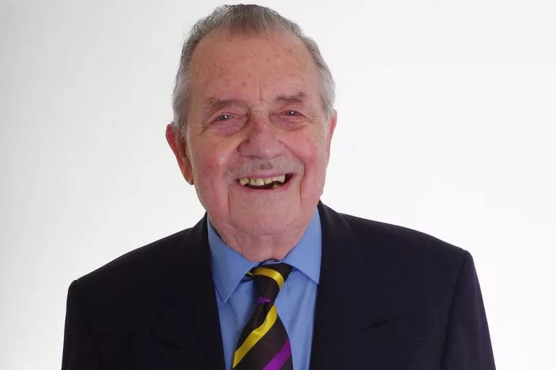 Frank Ward, standing for Reform UK in Bassetlaw, wearing a suit and the party's blue rosette