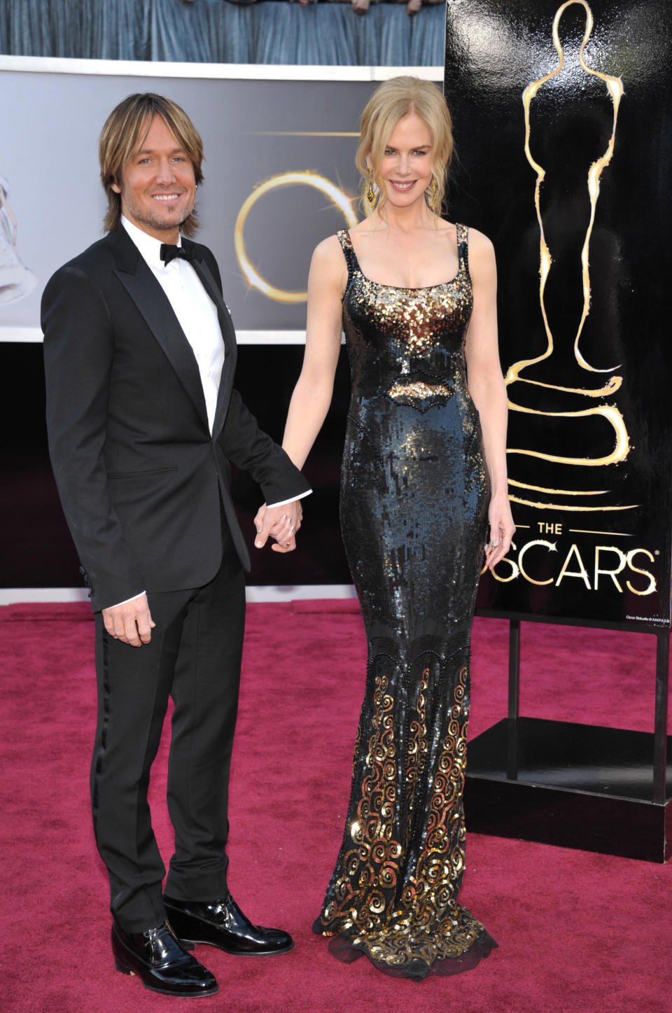 FILE - This Feb. 24, 2013 file photo shows musician Keith Urban, left, and his wife actress Nicole Kidman at the Oscars at the Dolby Theatre in Los Angeles. urban is a judge on the singing competition series, "American Idol," airing Wednesdays and Thursdays on Fox. (Photo by John Shearer/Invision/AP, file)