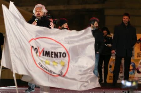 5-Star Movement founder Beppe Grillo speaks during the finally rally ahead of the March 4 elections in downtown Rome, Italy, March 2, 2018. REUTERS/Tony Gentile