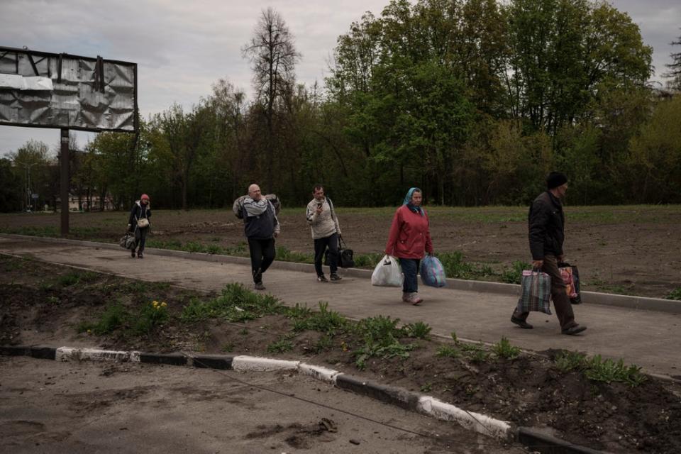 Hundreds of residents were evacuated to Kharkiv from the village, which had been under Russian occupation for more than a month (AP)