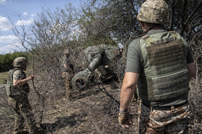 Ukrainian artillerymen in the military assembly center check the weapons and special equipment to make them ready before they go to their duties at the frontline in Kherson, Ukraine on July 15, 2022. (Metin Aktas/Anadolu Agency via Getty Images)