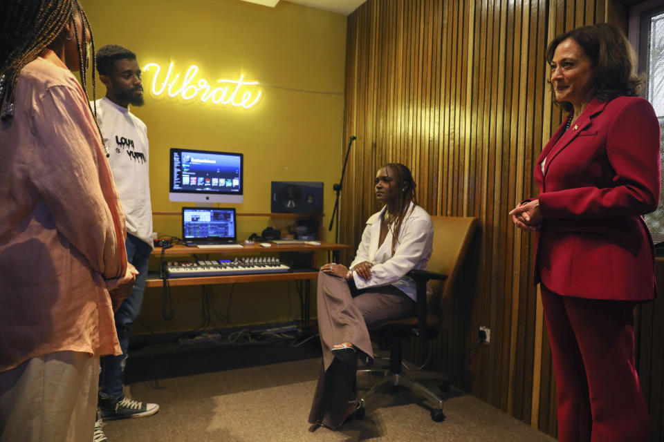 FILE - Vice President Kamala Harris, right, meets Ghana singer Ama Serwah Genfi, second right, known professionally as Amaarae, and Vibrate Space founder Sandy Alibo, left at the Vibrate Space a community recording studio for young creatives, at the Freedom Skatepark in Accra, Ghana, Monday, March 27, 2023. (Nipah Dennis/Pool Photo via AP, File)